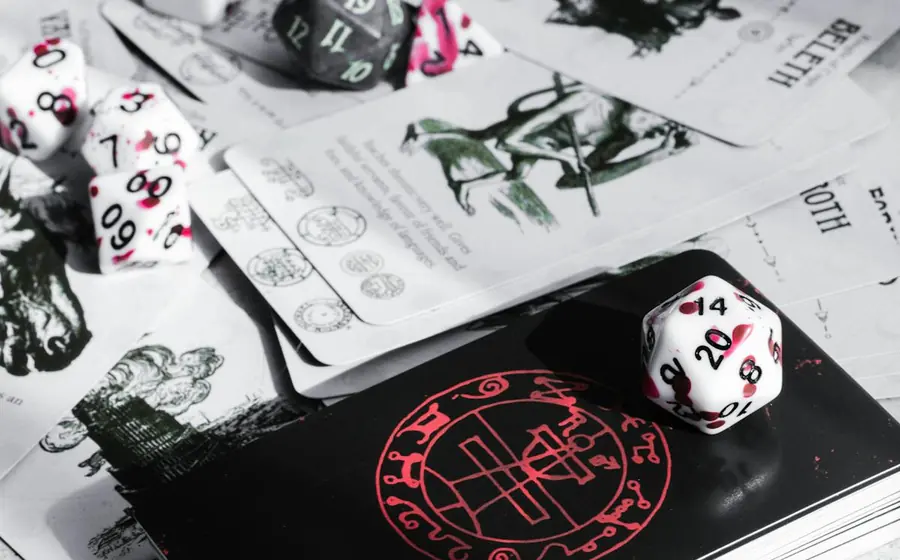 Golf Solitaire score review with cards and dice on a tabletop
